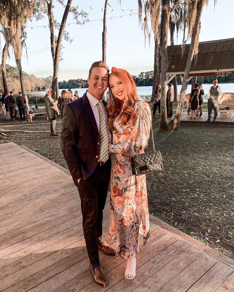 Ranger tie worn with a white shirt, black suit and brown shoes.