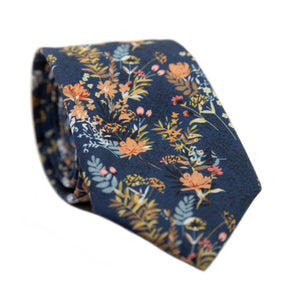 Tiger Lily Skinny Tie. Dark navy blue background with peach flowers and dusty blue, yellow, green and black leaves.