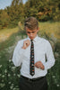 Utah tie worn with a white shirt, black belt and dark charcoal gray pants.