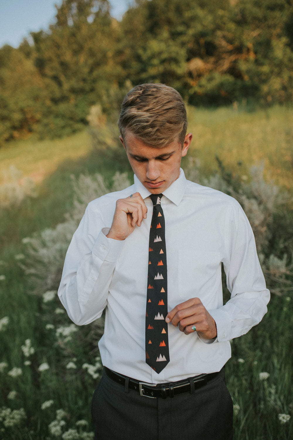 Utah tie worn with a white shirt, black belt and dark charcoal gray pants.