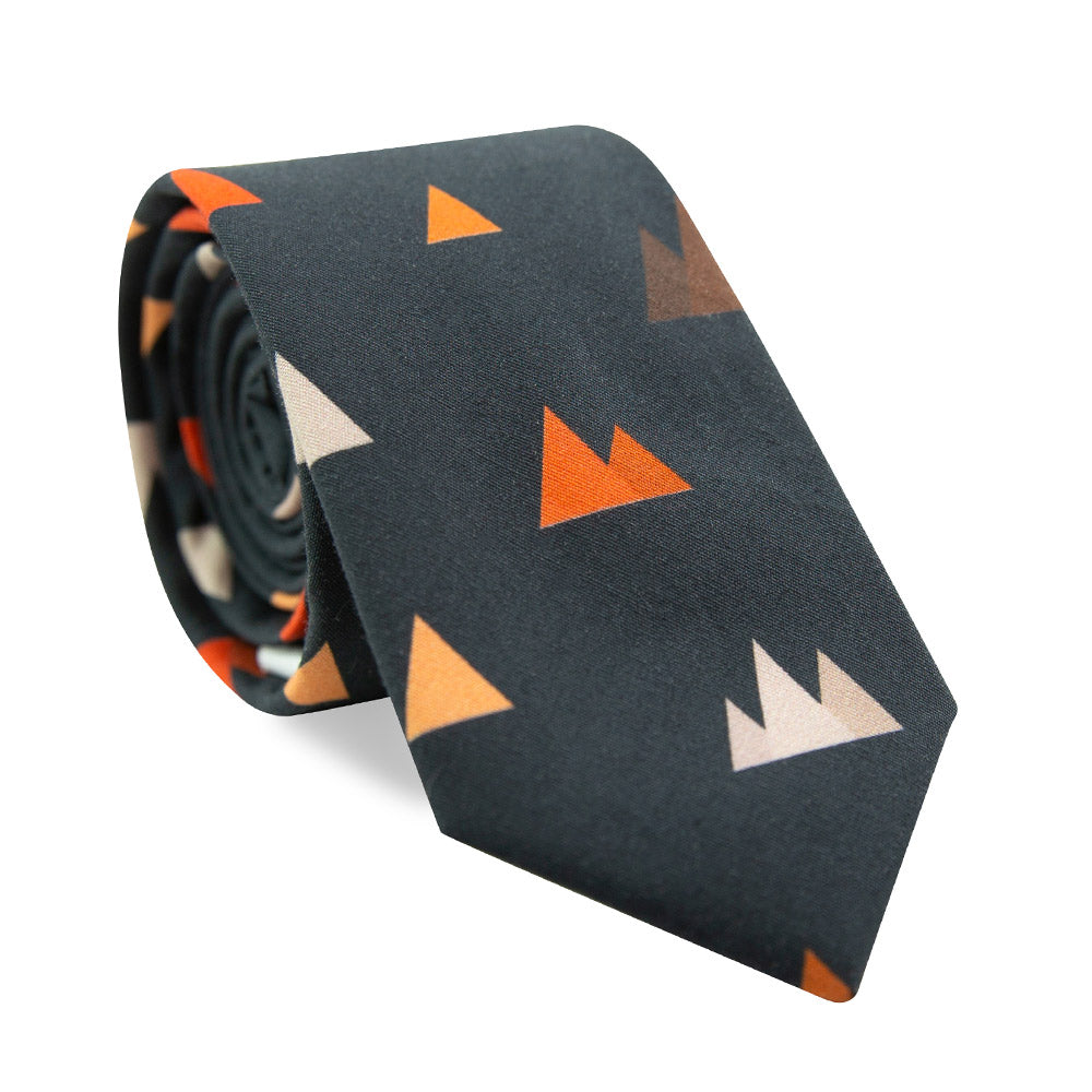 Utah Skinny Tie. Navy background with small triangle mountain shapes in gray, orange and brown.
