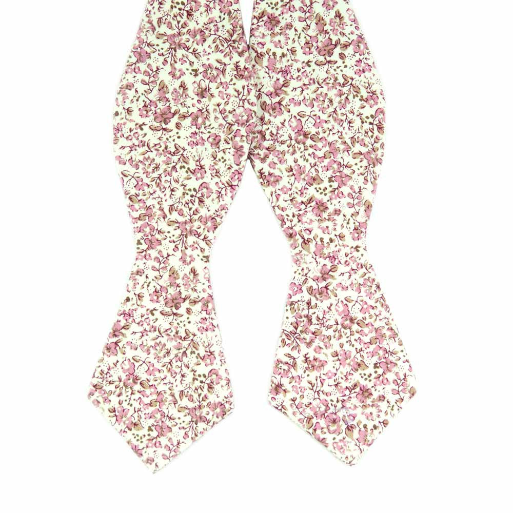 Ventura Self Tie Bow Tie. Off-white background with small blush pink and light brown flowers and leaves.