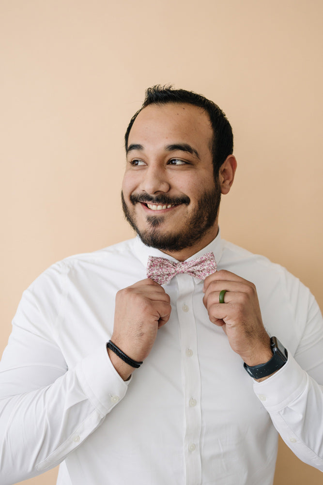 Ventura pre-tied bow tie worn with a white long sleeve shirt.