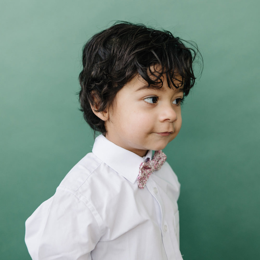 Ventura pre-tied bow tie worn with a white long sleeve shirt.