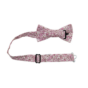 Ventura Pre-Tied Bow Tie with adjustable neck strap. Off-white background with small blush pink and light brown flowers and leaves.