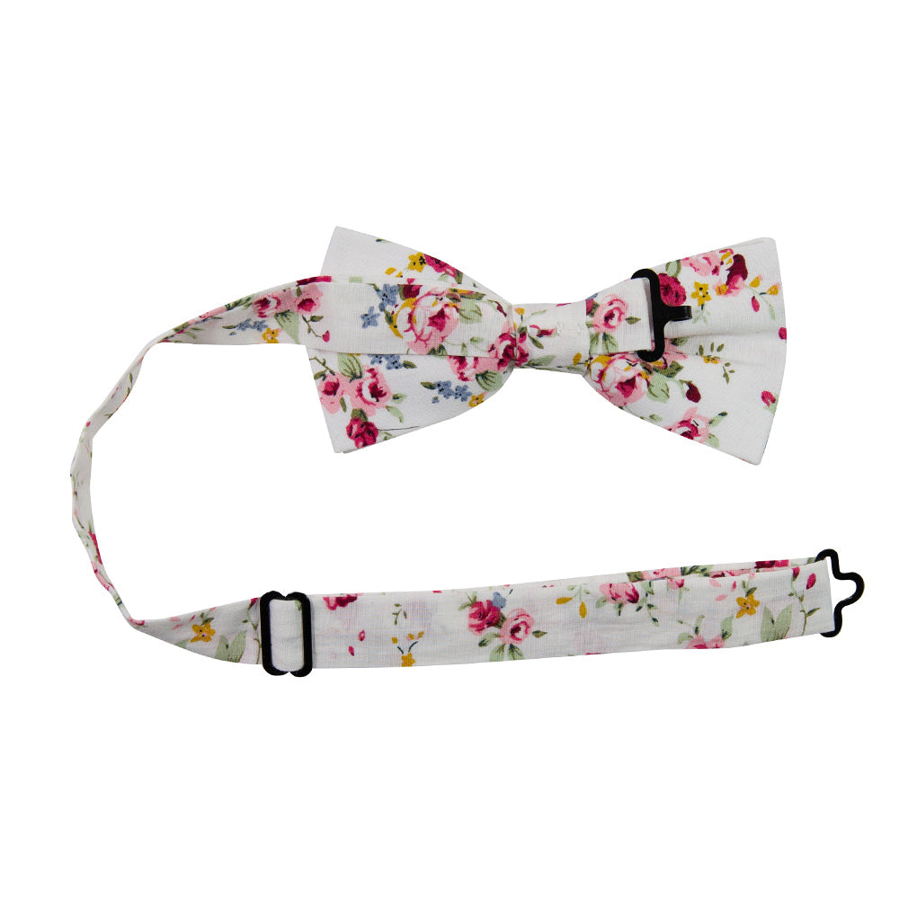 White Floral Pre-Tied Bow Tie with adjustable neck strap. White background with red, pink, blue and gold flowers. Green leaves and stems.