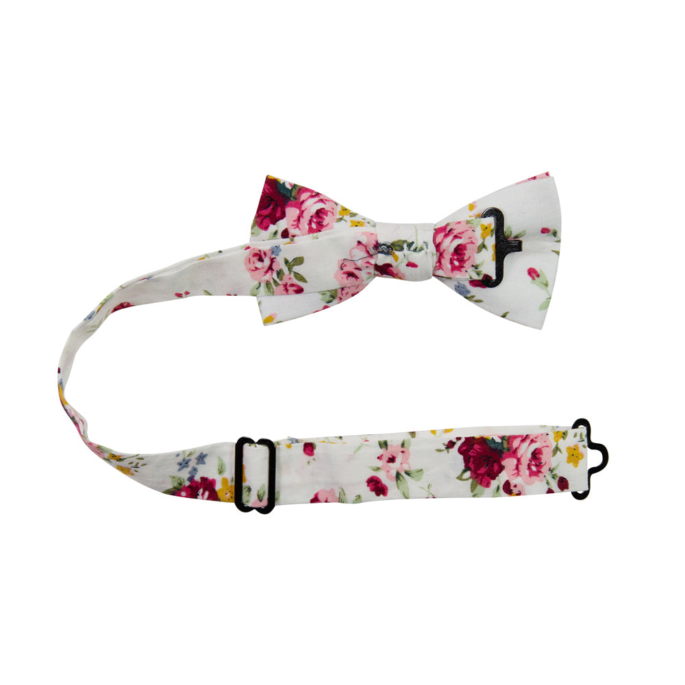 White Floral Pre-Tied Bow Tie with adjustable neck strap. White background with red, pink, blue and gold flowers. Green leaves and stems.