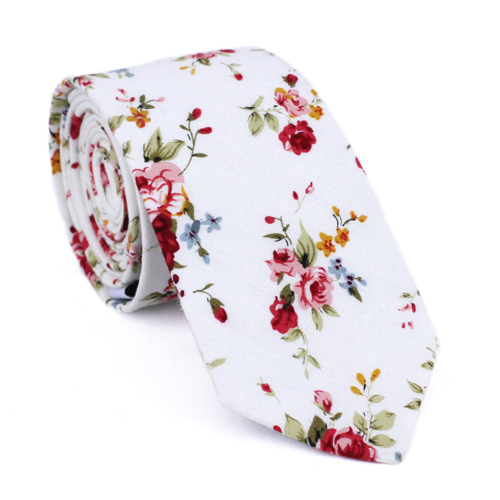White Floral Skinny Tie. White background with red, pink, blue and gold flowers. Green leaves and stems.